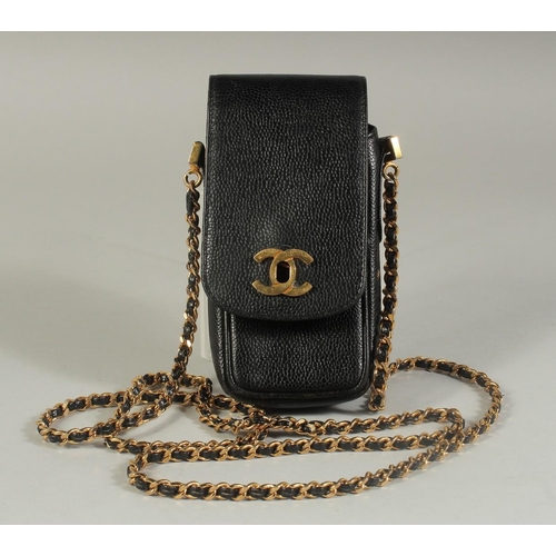 1323 - A CHANEL BLACK LEATHER SPECTACLE CASE, 6.5ins x 3ins with a long entwined gilt metal and leather str... 