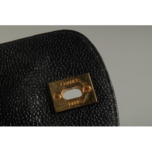 1323 - A CHANEL BLACK LEATHER SPECTACLE CASE, 6.5ins x 3ins with a long entwined gilt metal and leather str... 