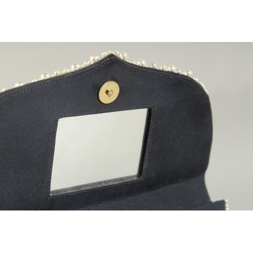 1325 - A BLUE VELVET AND PEARL EVENING BAG the inside with a small mirror. 7.5ins long.