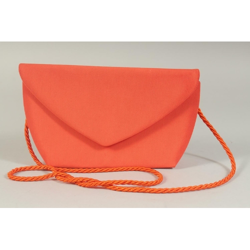 1328 - A G Y ITALIAN ORANGE FABRIC EVENING BAG, 8ins long with rope strap.