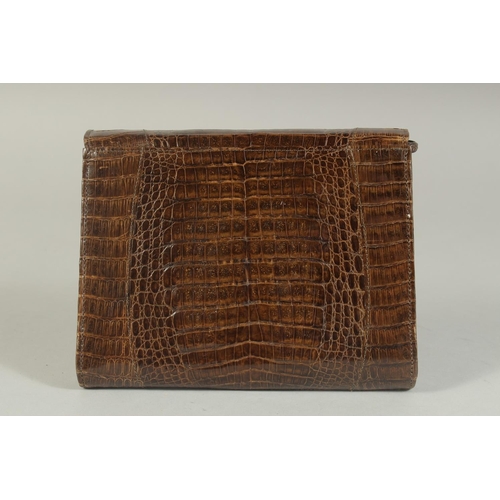 1329 - AN A R WEST GERMANY, BROWN CROCODILE SKIN HANDBAG, 6.5ins long, with rope handles.