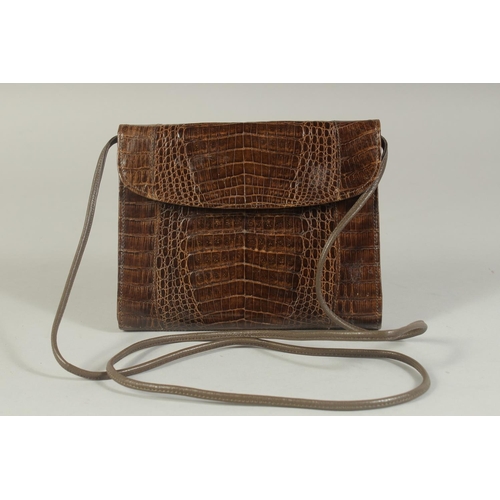 1329 - AN A R WEST GERMANY, BROWN CROCODILE SKIN HANDBAG, 6.5ins long, with rope handles.