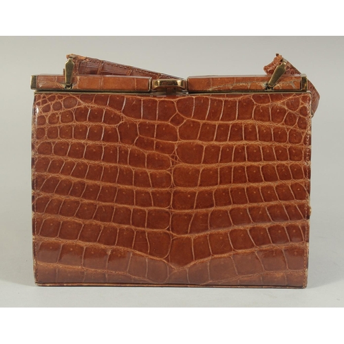 1330 - A 1960's - 1970's CROCODILE SKIN HANDBAG, 8ins long.