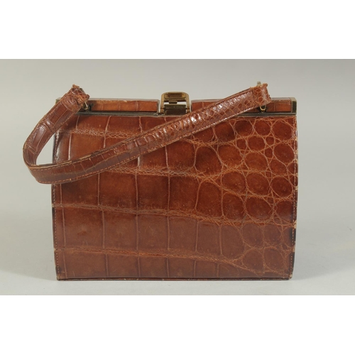 1330 - A 1960's - 1970's CROCODILE SKIN HANDBAG, 8ins long.