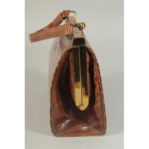 1330 - A 1960's - 1970's CROCODILE SKIN HANDBAG, 8ins long.