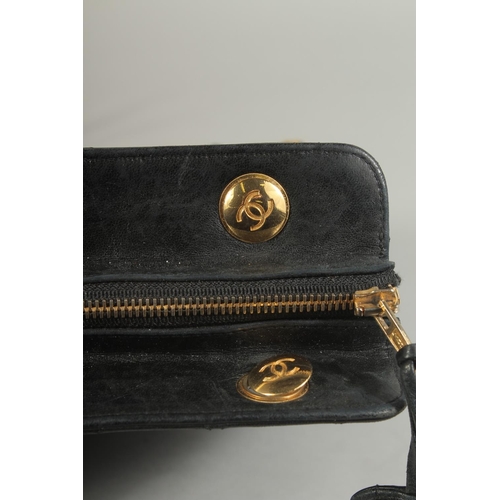 1335 - A LARGE CHANEL BLACK PADDED LEATHER BAG, 13ins long, 10ins high, with entwined gilt metal and leathe... 