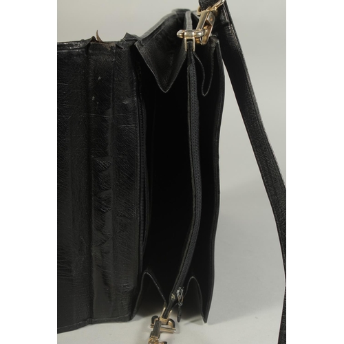 1336 - A MADDLER ZURICH BLACK CROCODILE SKIN BAG (USED) 9ins long, 11ins high.