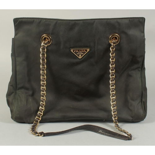 1337 - A PRADA MILANO SOFT BLACK BAG, 12ins, 10ins high with entwined gilt metal and leather strap.