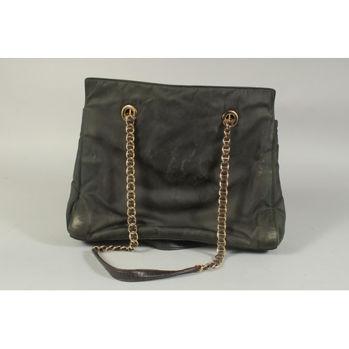 1337 - A PRADA MILANO SOFT BLACK BAG, 12ins, 10ins high with entwined gilt metal and leather strap.