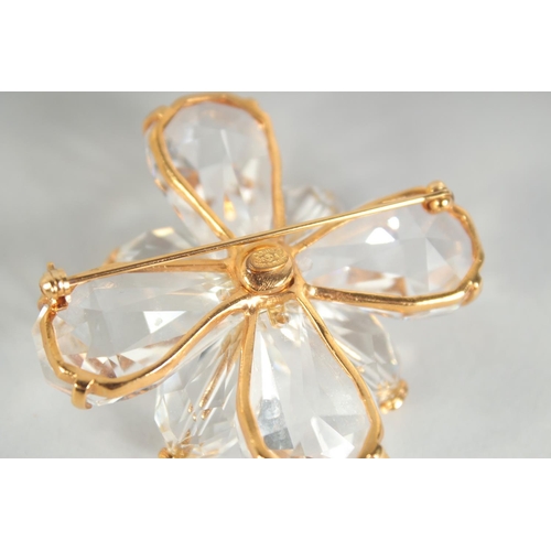 1354 - A LARGE CHANEL EIGHT PETAL FLOWER BROOCH with CC in diamante, in a Chanel box. 4.5cm diameter.