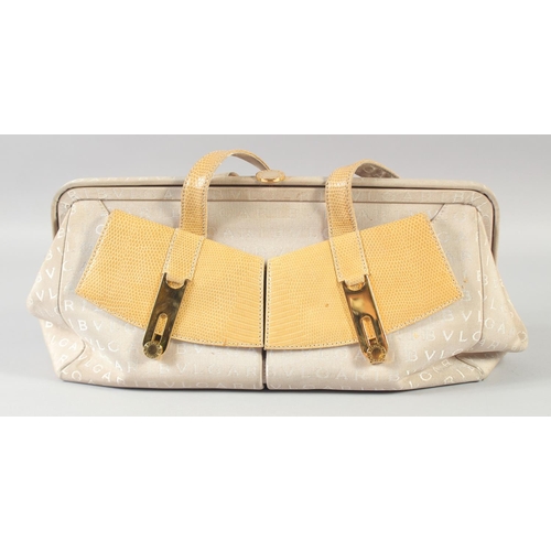 1358 - A GOOD BULGARI CREAM PART LEATHER BAG, two shades, two purses at the front. 44cm long x 20cm high.... 