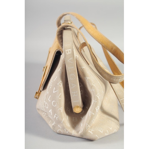 1358 - A GOOD BULGARI CREAM PART LEATHER BAG, two shades, two purses at the front. 44cm long x 20cm high.... 