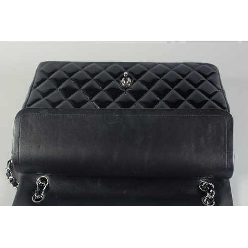 1359 - A VERY GOOD LARGE CHANEL BLACK PATENT LEATHER HANDBAG with long chrome and leather straps. 33cm long... 