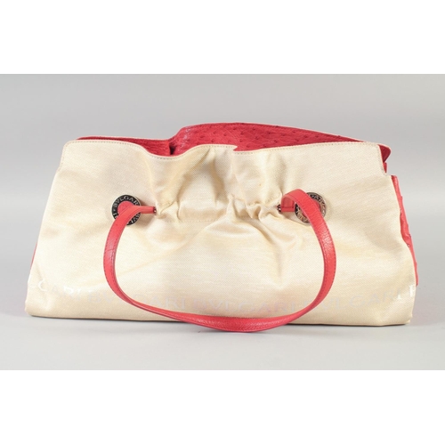 1360 - A BULGARI PART LEATHER CREAM AND RED HANDBAG with crocodile flaps. 41cm long x 22cm high.