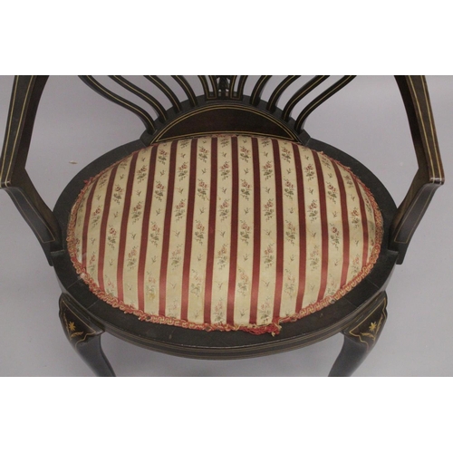 1020 - A VICTORIAN ROSEWOOD INLAID TUB ARMCHAIR with padded seats on curving legs.