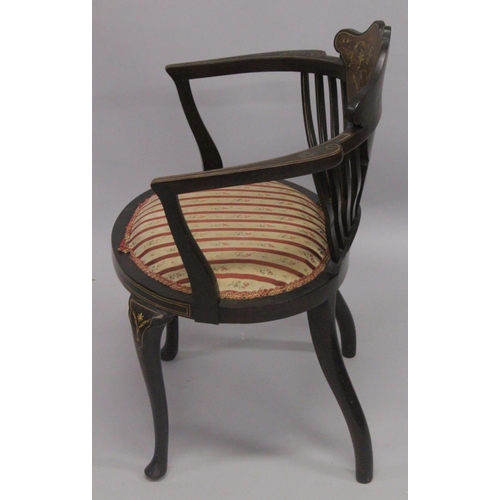 1020 - A VICTORIAN ROSEWOOD INLAID TUB ARMCHAIR with padded seats on curving legs.