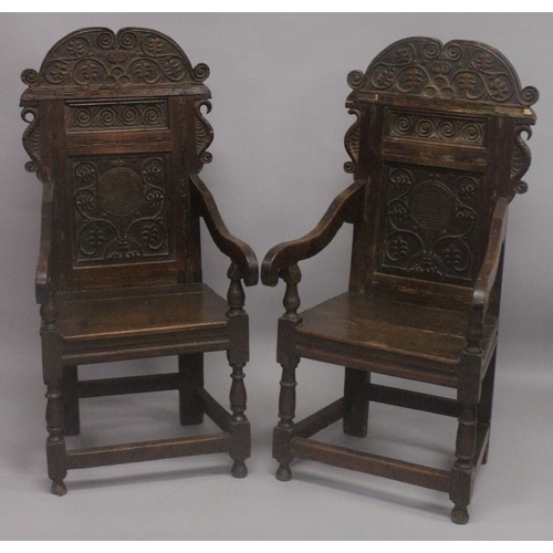 1024 - A GOOD PAIR OF MOSTLY 17TH - EARLY 18TH CENTURY OAK WAINSCOT CHAIRS with carved backs, bog oak inlay... 