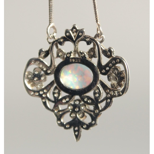 1809 - A SILVER AND OPAL PENDANT AND CHAIN.