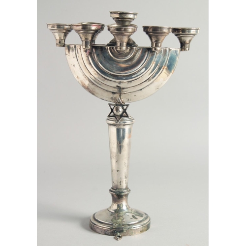 1957 - A GOOD JEWISH SILVER MENORAH on a circular base. 12ins high.