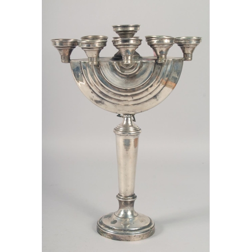 1957 - A GOOD JEWISH SILVER MENORAH on a circular base. 12ins high.