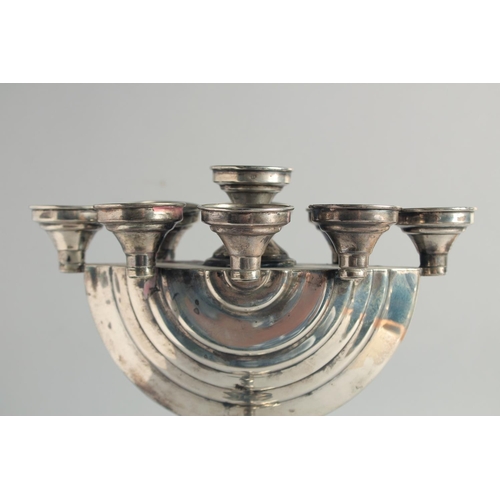 1957 - A GOOD JEWISH SILVER MENORAH on a circular base. 12ins high.