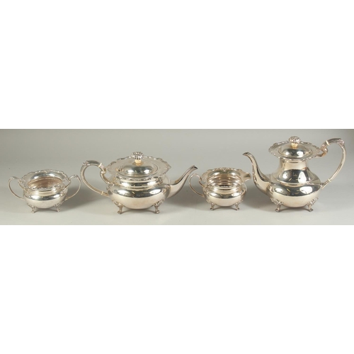 1958 - A VERY GOOD FOUR PIECE SILVER CIRCULAR TEA SET of pie crust design with shell mounts, comprising: te... 