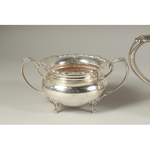 1958 - A VERY GOOD FOUR PIECE SILVER CIRCULAR TEA SET of pie crust design with shell mounts, comprising: te... 