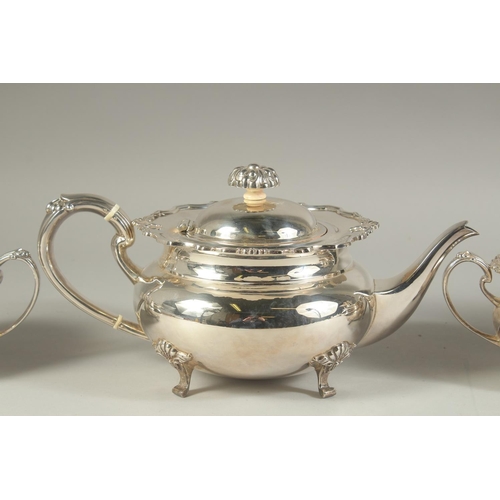 1958 - A VERY GOOD FOUR PIECE SILVER CIRCULAR TEA SET of pie crust design with shell mounts, comprising: te... 