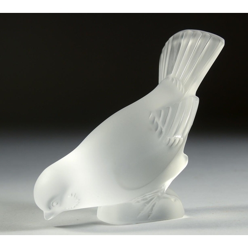 1091 - A LALIQUE FROSTED GLASS BIRD, wings open Signed, Lalique, France. 5.25ins long.