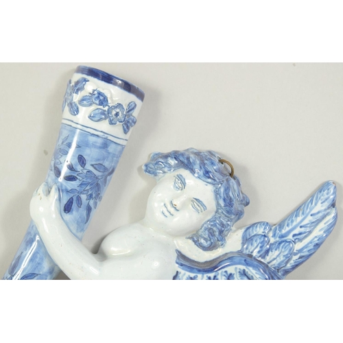 1115 - A DELFT POTTERY BLUE AND WHITE ANGEL WALL POCKET. 9.5ins.