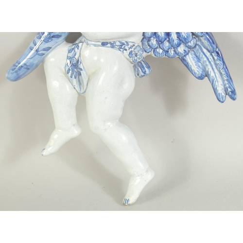 1115 - A DELFT POTTERY BLUE AND WHITE ANGEL WALL POCKET. 9.5ins.