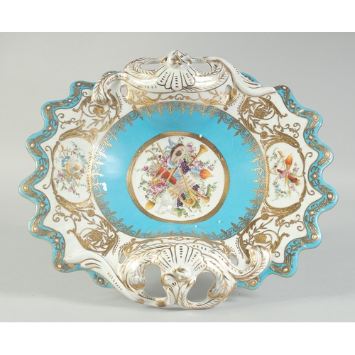 1124 - A SEVRES STYLE BLUE, WHITE AND GILT COMPORT painted with vignettes of musical instruments. 1ft 1ins ... 