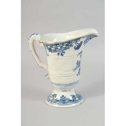 1132 - AN 18TH CENTURY ROUEN BLUE AND WHITE HELMET SHAPED JUG. 8ins high.