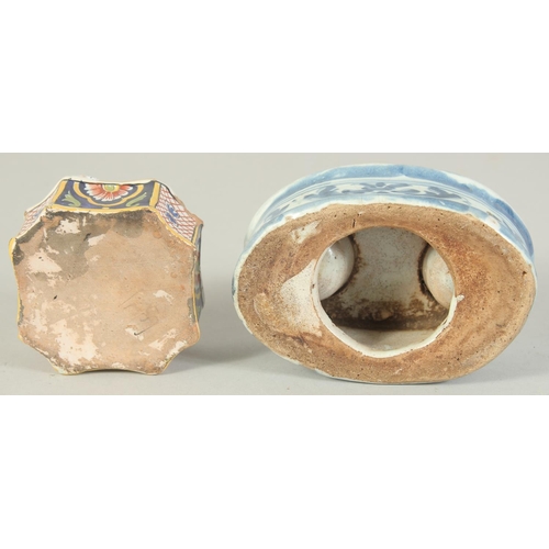 1137 - TWO FAIENCE TIN GLAZE INK POTS, one blue and white with two ink pots, the other coloured with one in... 