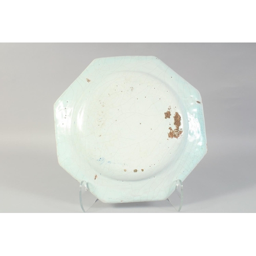 1142 - A GOOD 18TH CENTURY CONTINENTAL BLUE AND WHITE OCTAGONAL CHARGER. 14ins diameter.