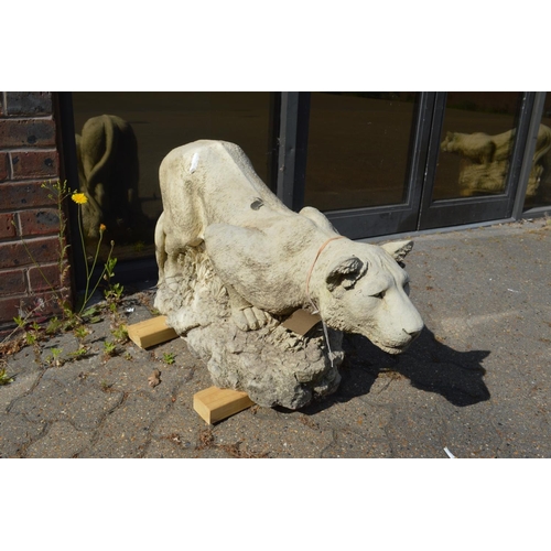 1 - A good pair of reconstituted stone garden ornaments modelled as prowling lions.