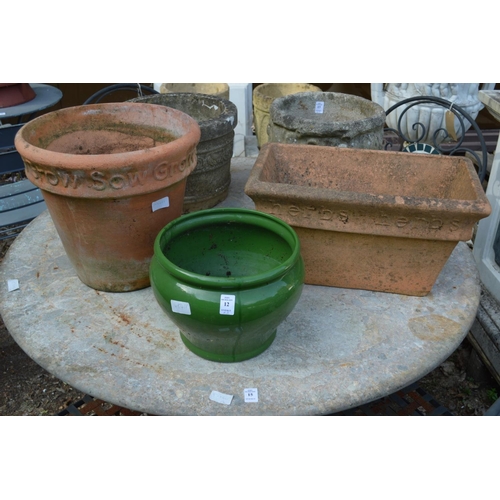 12 - A green glazed planter and two terracotta plant pots.