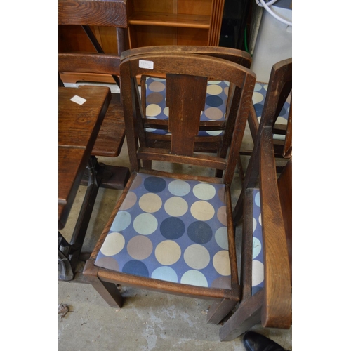 180 - A set of four 1930's oak dining chairs, one with arms.