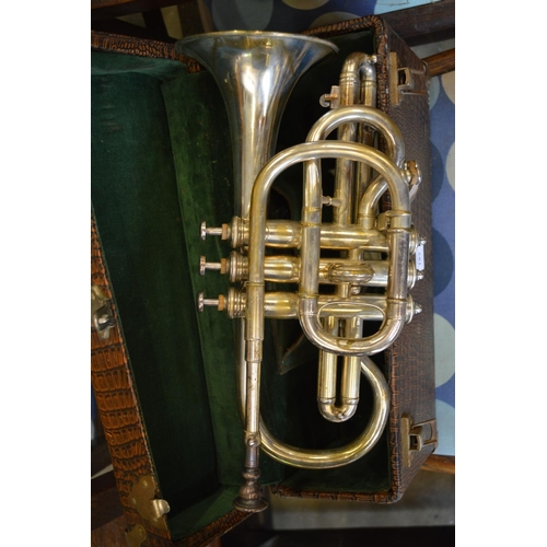 182 - A cased trumpet.