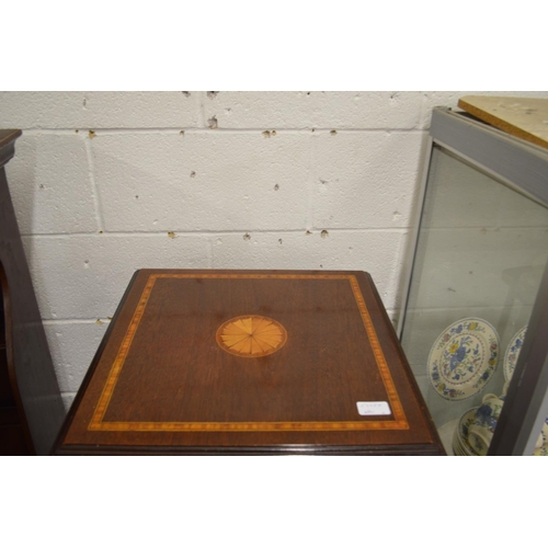 258 - An Edwardian style mahogany revolving bookcase.