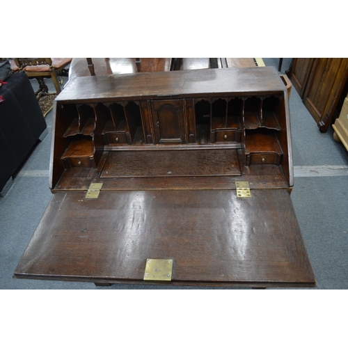 267 - A George III oak bureau.