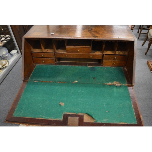 279 - A George III oak bureau.