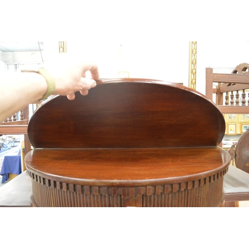 336 - A mahogany demi-lune fold over tea table with tambour storage doors.