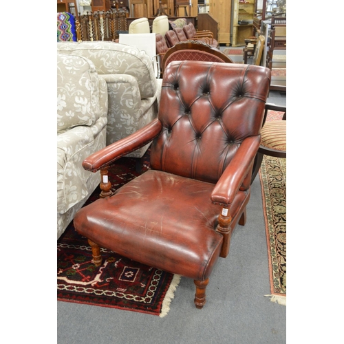 343 - A good pair of red leather button upholstered open armchairs.