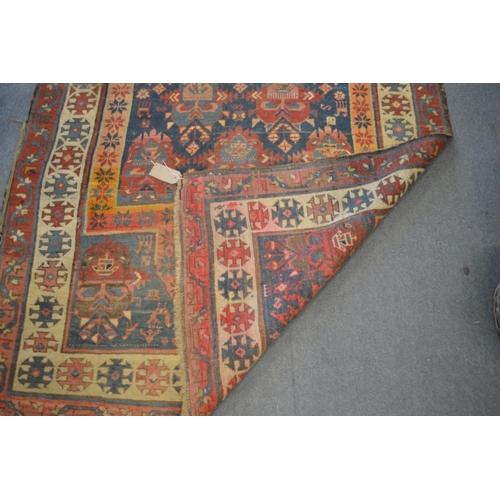 357 - A Persian carpet, early 20th century, blue ground with stylised decoration, 260cm x 140cm.