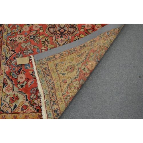 360 - A Persian rug, pink ground with floral decoration, 168cm x 103cm.