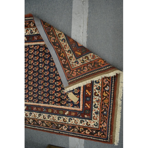 361 - A Persian runner or hall carpet, decorated with stylised Boteh design, 450cm x 110cm.