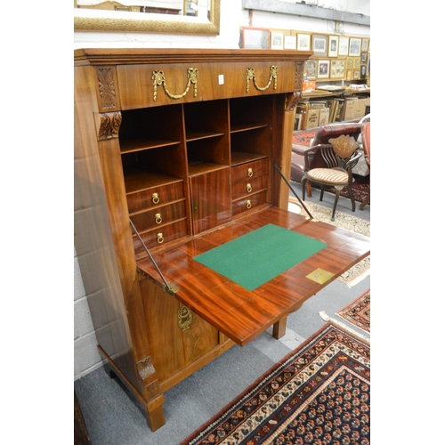 376 - A 19th century French mahogany and ormolu mounted secretaire a abattant.