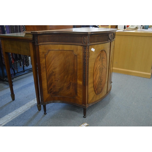 381 - A good Hepplewhite style mahogany two door commode of bow fronted form with concave sides, carved an... 