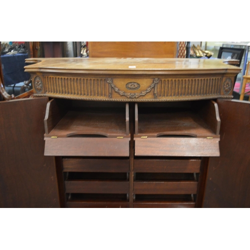 381 - A good Hepplewhite style mahogany two door commode of bow fronted form with concave sides, carved an... 